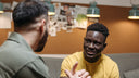 An older man and younger man in conversation — the kind of talk that stays with you.