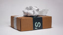 A Henkey's box with a large silver bow.