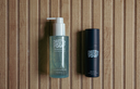 Two Pretty Boy products on a wooden background.