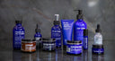 A display. of Blu Atlas products against a grey marble background.