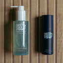 Two Pretty Boy products on a wooden background.