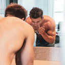 A man washing his face.