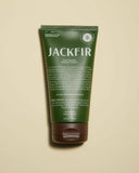Green tube of Jackfir shave cream on a beige background