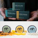 Three boxes of Brightside hair care products held by a person with tattooed hands, followed by three containers of the same products on a white background.