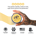 Hand holding a jar of Hybrid Pomade with product features highlighted on a white background