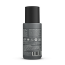 The back view of a dark gray bottle with a black cap, showing the product's ingredients and instructions on a white background.